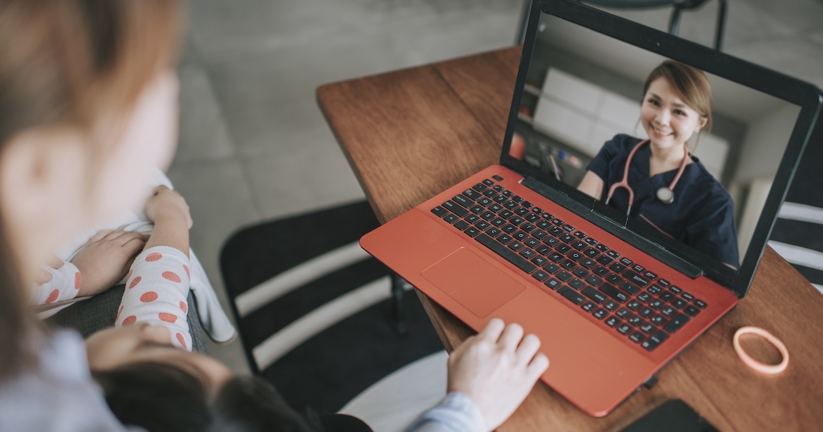 Healthcare professional engaging in telehealth visit with patient